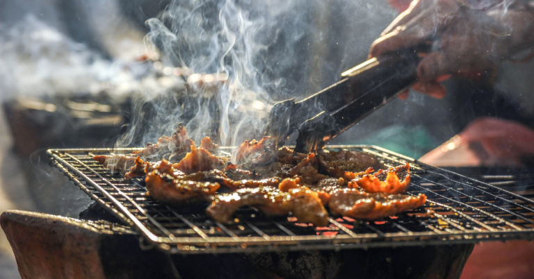 BBQ Meat Being Smoked on the Grill