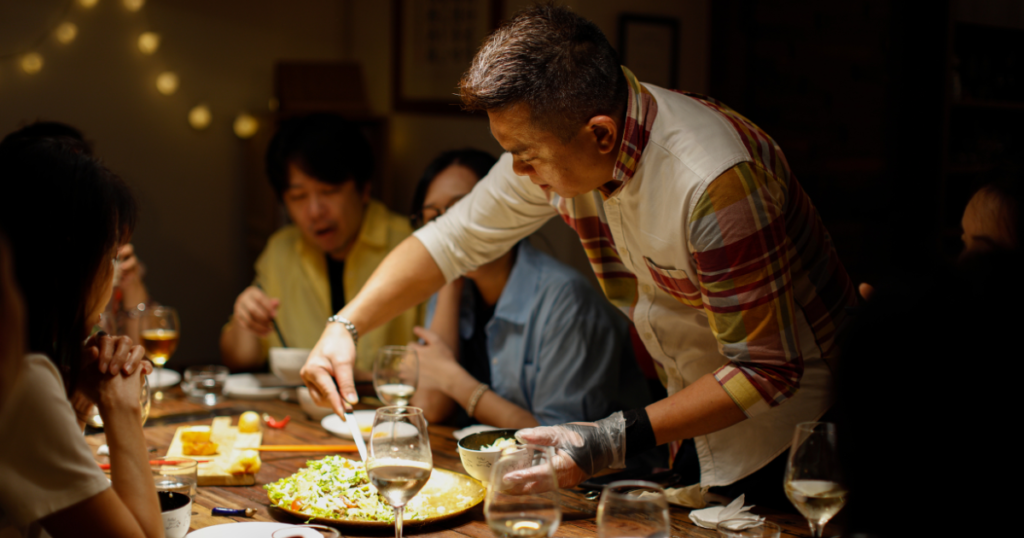 A personal chef serving dinner to a family of 4